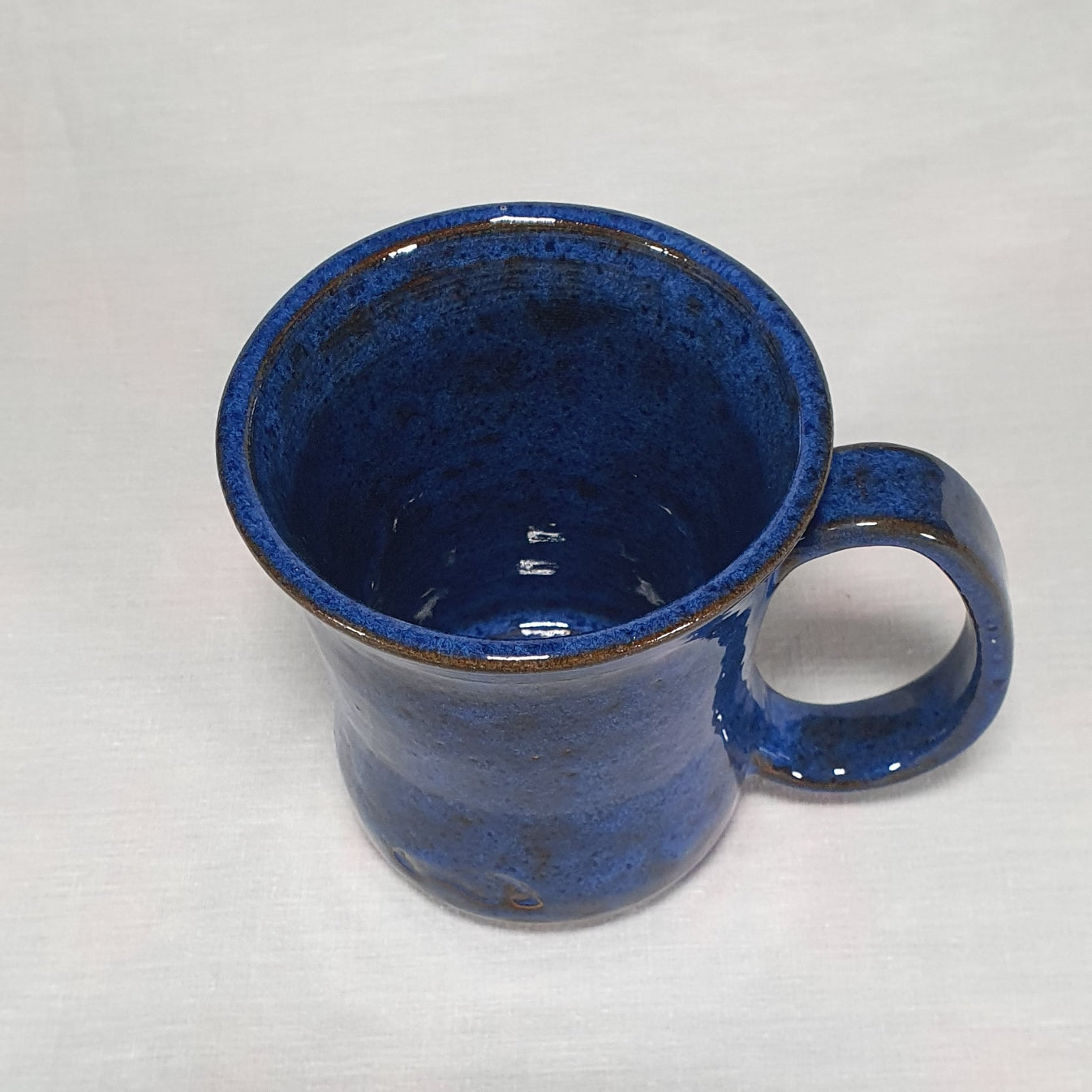 Blue hand made pottery mug.