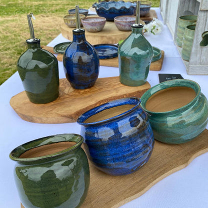 Handmade oil bottles and salt pigs from Footprint Pottery